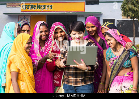 Group Rural Ladies School Students And Teacher Teaching Laptop E-Learning Village Stock Photo