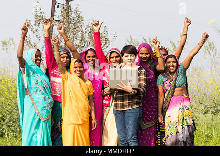 Group Rural Womens And Advisor Laptop E-Learning Victory Success Field-Village Stock Photo