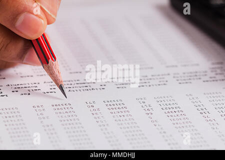 Close-Up Accountant Man Hand checks financial Reports document part-of Stock Photo