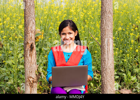 Rural Villager High-School Girl Student Sitting Farm laptop Working E-Learning Stock Photo