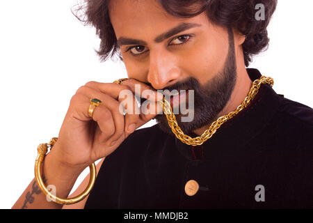 Close up of young handsome man with thick gold chain Stock Photo