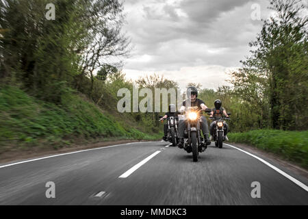Bikers riding on the road. Motorcycle club out for a ride in England Stock Photo