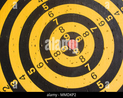 diagonal view of an used dartboard Stock Photo