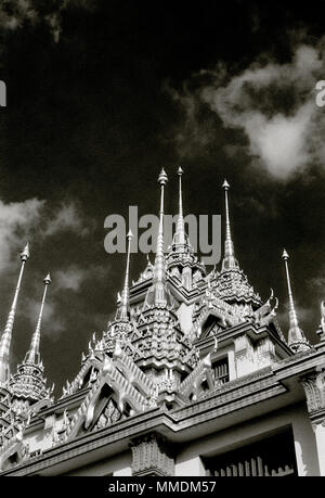 Spires of the Buddhist temple Loha Prasat Metal Castle of Wat Ratchanadda in Bangkok in Thailand in Southeast Asia Far East. Travel Wanderlust B&W Stock Photo