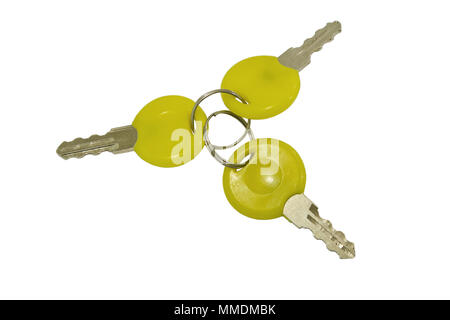 A bunch of three small keys isolated on a white background Stock Photo