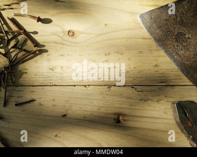 Joiner's tools set. Real work background. Pliers, old rusty nails and axe Stock Photo