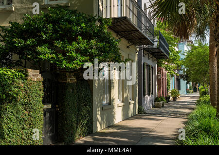 Summer Street - Summer morning view of one of many quiet, colorful and well-preserved historic streets in Downtown Charleston, South Carolina, USA. Stock Photo