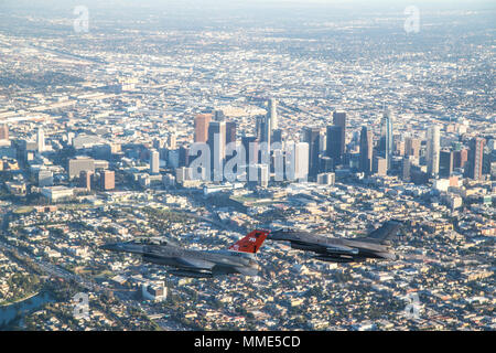 LOS ANGELES (Oct. 25, 2017) F-16 Fighting Falcons from the 416th Flight Test Squadron circle Downtown Los Angeles as part of a four-ship flyover that kicked off Game 2 of the World Series at Dodger Stadium. The 416th Flight Test Squadron conducts developmental testing for the F-16 while supporting additional objectives throughout the Air Force, which recently observed it's 70th anniversary of supersonic flight. (U.S. Air Force photo by Christopher Okula) Stock Photo