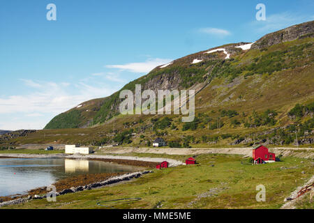 Red cabins along the shoreline at North Cape, Norway. Stock Photo