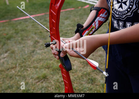 11-year-old boy practising archery in Paris, France. Stock Photo