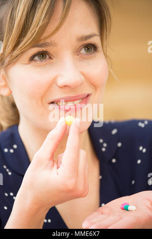 WOMAN TAKING MEDICATION Stock Photo