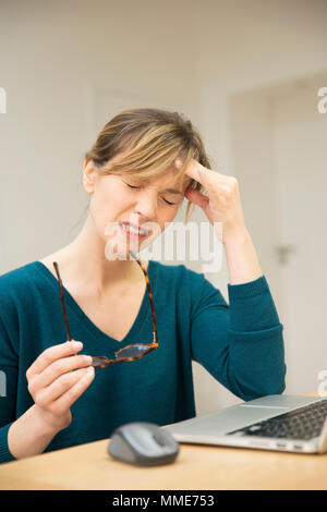 WOMAN WITH HEADACHE Stock Photo