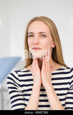 CONSULTATION, WOMAN IN PAIN Stock Photo