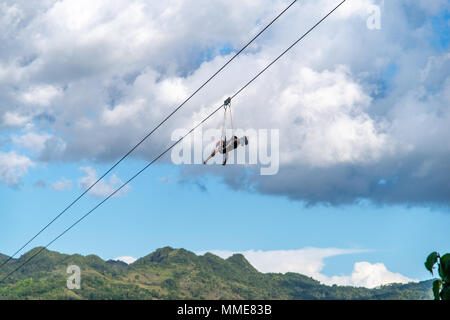 Tourists on the Zip Line at Bohol Island, Philippines Stock Photo