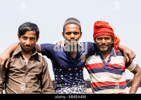 Dhaka, Bangladesh - February 2017: Men Carrying Wood On The Banks Of 