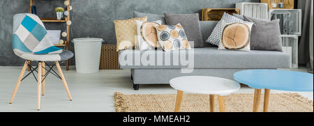 Panoramic photo of a modern apartment arranged with various textiles and patterns Stock Photo