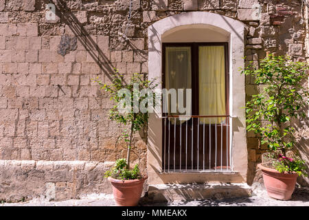 the window with the railing on stone wall, for background Stock Photo