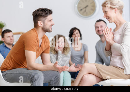 Conversation with psychologist during support group meeting Stock Photo