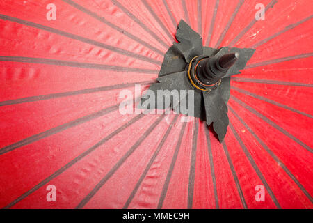 Red color umbrellas close up, traditional asian craftsmanship in Thailand and myanmar , background texture Stock Photo