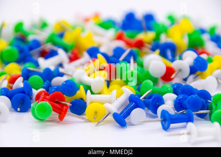 Pile of plastic notice board push pins on a white background Stock Photo