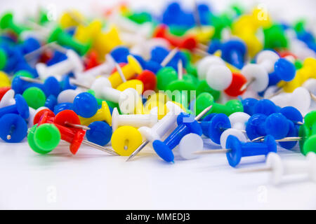 Pile of plastic notice board push pins on a white background Stock Photo