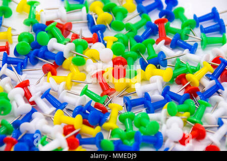 Pile of plastic notice board push pins on a white background Stock Photo