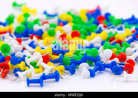 Pile of plastic notice board push pins on a white background Stock Photo