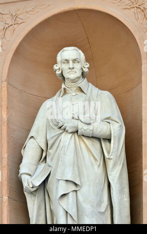 London, England, UK. Statue: Adam Smith (by William Theed) on Burlington Gardens facade of the Royal Academy (Burlington House) Cleaned and restored.. Stock Photo