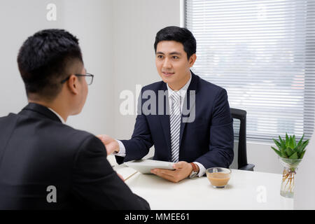 Job interview of two business professionals. Greeting new colleague Stock Photo