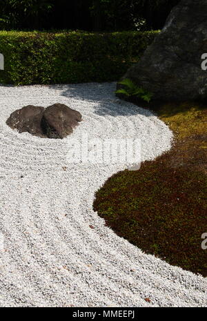 Zen garden with raked gravel and big stones in Kyoto, Japan. Stock Photo