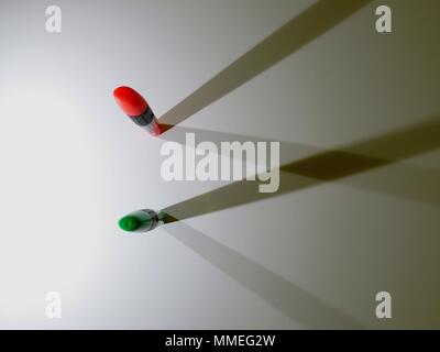 Highlighters casting shadows on white background. Stock Photo