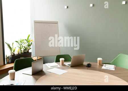 Conference table with laptops in office meeting room with nobody Stock Photo
