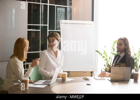Businesswomen having discussion at executive team office meeting Stock Photo