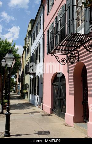 Rainbow Row - Summer view of Rainbow Row, a series of well-preserved historic Georgian row houses on East Bay street, in Downtown Charleston, SC, USA. Stock Photo