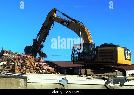 https://l450v.alamy.com/450v/mmem5b/workers-with-contractor-alliance-steel-construction-inc-of-superior-wis-remove-debris-of-an-old-building-oct-20-2017-on-the-cantonment-area-at-fort-mccoy-wis-the-contractor-removed-12-buildings-as-part-of-a-task-order-coordinated-by-the-directorate-of-public-works-much-of-the-materials-from-the-demolition-especially-the-concrete-were-recycled-for-other-uses-us-army-photo-by-scott-t-sturkol-public-affairs-office-fort-mccoy-wis-mmem5b.jpg