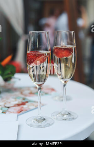 Champagne with strawberries on a party Stock Photo