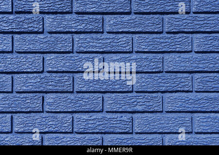 Closeup of an exterior brick wall painted in blue. Stock Photo