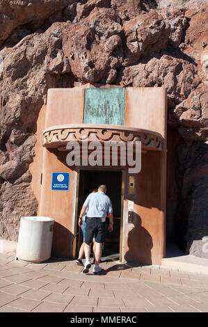 People taking an elevator to the visitor centre at Hoover Dam, on the Nevada-Arizona border, USA. Stock Photo