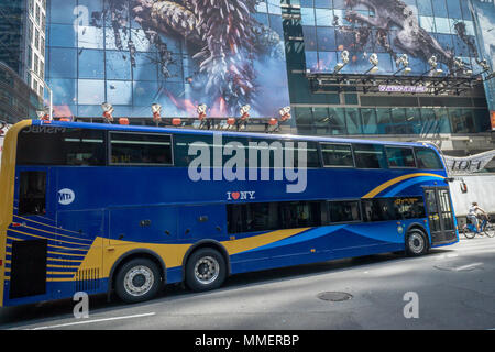 The all-new double-decker test bus passes through Midtown Manhattan in New York on Thursday, May 3, 2018. The higher capacity bus running as a test will travel on the X17J route between Staten Island and Midtown Manhattan. (© Richard B. Levine) Stock Photo