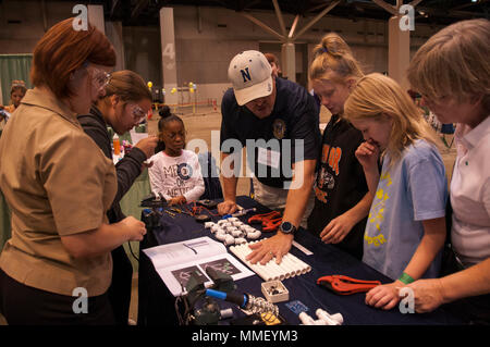 SeaPerch is an educational program developed by the Office of Naval Research to introduce students to naval architecture, marine engineering, and remotely operated vehicle design through hands-on construction projects. The archival image documents a Navy Recruiting District St. Louis outreach activity where participants learn components of an underwater ROV during a Shades of Green educational event on October 28, 2017. Stock Photo