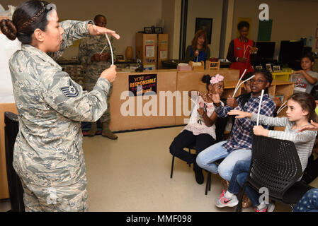 U.S. Air Force School of Aerospace Medicine is an Air Force Medical Service organization at Wright-Patterson Air Force Base, Ohio. A public health instructor demonstrates inner ear hair cell function using pipe cleaners during the “”Dangerous Decibels”” program for National Protect Your Hearing Month at the Wright-Patt Youth Center on Oct. 27, 2017. The archival image records a hearing conservation education activity. Stock Photo