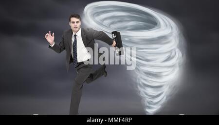 Tornado twister painted and dark sky with businessman running Stock Photo