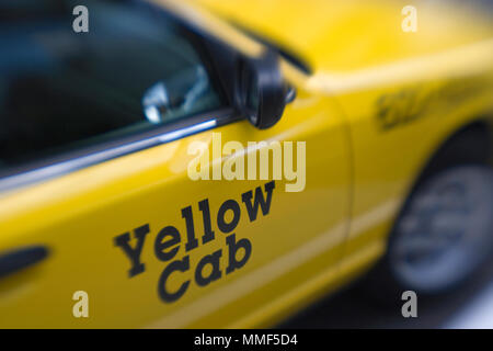 The door of a yellow taxi has the words Yellow Cab written on the door. Horizontal shot. Stock Photo