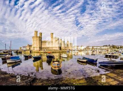 The skyline of Caernafon in Wales during low tide - United Kingdom. Stock Photo