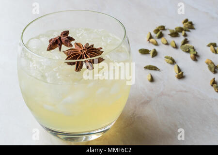 Cardamom Cocktail with Anise Star and Crushed Ice. Beverage Concept. Stock Photo