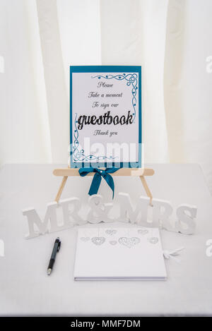 Wedding Guestbook on a table with Mr and Mrs Letters Stock Photo