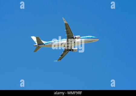 KLM Cityhopper Embraer 175, medium-range twin-engine jet airliner in flight Stock Photo