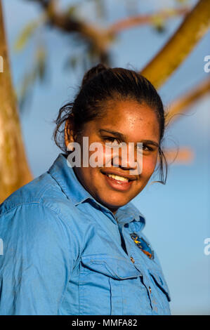 An aboriginal student learns about rescued wild horses known as a brumby's on an outback station. Stock Photo