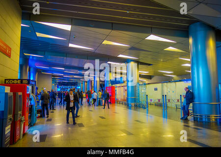 MOSCOW, RUSSIA- APRIL, 24, 2018: Indoor view of passengers walking and waiting for the departure in the huge waiting hall of the international airport of Vnukovo Stock Photo