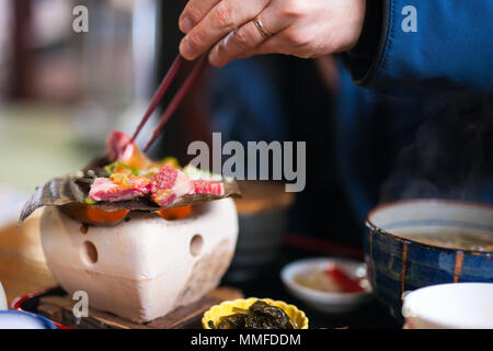 Traditional Japanese lunch with hida beef prepared on grill Stock Photo
